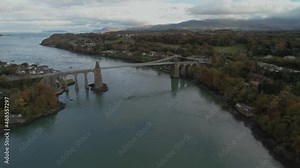 Impressive view of the Menai Suspension Bridge. Anglesey, beautiful scenery, drone shot