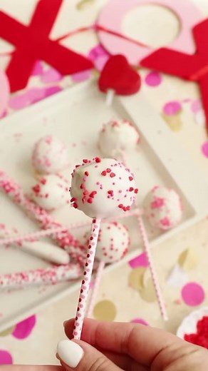get ready to sweeten up your valentine's day with homemade cake pops! 💘🍰✨ our video tutorial will guide you through every step. share the love and share the joy of baking with someone special! 😍🍭 #valentinesday #cakepops #diysweets 1 box of strawberry cake mix cooked according to directions, using a 13x9 pan. leave out the oil.once the cake has cooled, mix with 1/4 cup vanilla frosting. form into about 12-15 cake balls. place in the freezer for 30 minutes to firm up. melt one bag of vanilla 