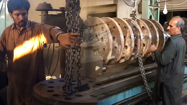 Expert Machinists Crafting Heavy Duty Rotor Shafts