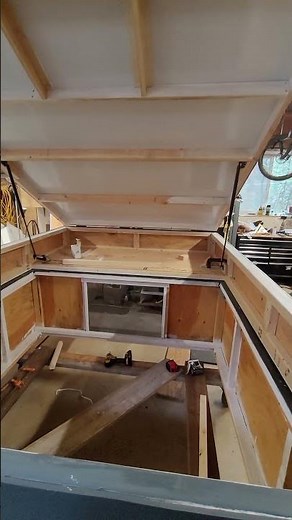 DIY wedge camper with gas struts installed