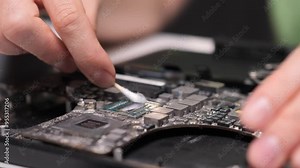 replacing thermal paste on computer processor. Close-up removing thermal paste