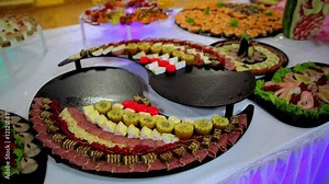 buffet: salads, meat and fish dishes are on the table