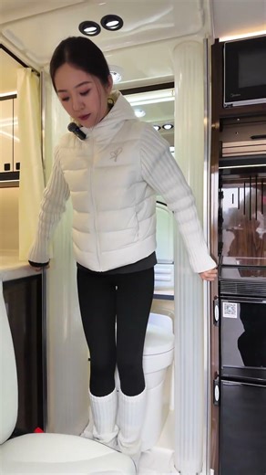 A small motorhome with a blue license plate and automatic transmission, fully equipped