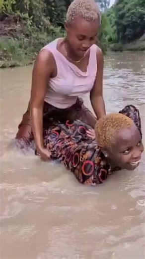 Africans playing and swimming in the river by African Hub