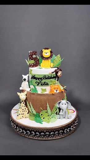 “Wildly sweet and roarin’ with love! This animal-themed cake brought the jungle to the party and made every little critter smile. From cuddly cubs to playful monkeys, this cake was a zoo-full of fun in every bite!” | Caketopia