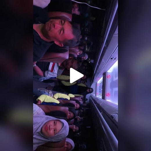 Cultural Celebration Inside a Bus: Joyful Moments Captured