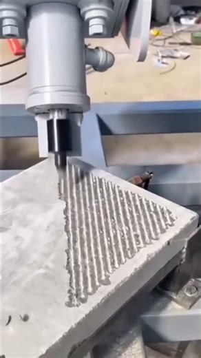 using precision industrial machines to carve deep triangular patterns with parallel grooves