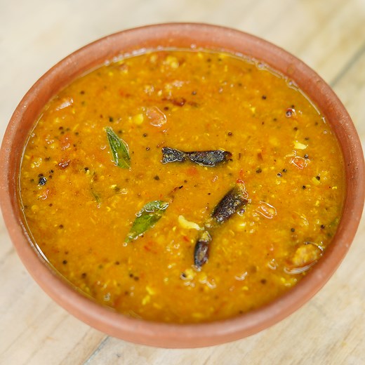 Ingredients Toor dal - 1 cup Tomatoes - 5 to 6 nos Shallots - 4 to 5 nos Garlic - 5 to 6 nos Curry leaves - 2 to 3 sprigs Dry red chillies - 4 to 5 nos Coriander seed - 1 tsp cumin seed - 1 tsp Pepper seed - 1 tsp Turmeric powder - 1 tsp Red chilli powder - 1 tsp Asafoetida powder - 1/2 tsp Mustard seed - 1 tsp Oil -2 to 3 tsp Method First we have to take a pan add toor dal and water . wash and drain them well. Take a mud pot add toordal and water . Thean add turmeric powder and stir them well. 