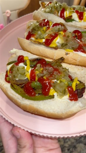 Bacon wrapped hot dogs in the air fryer 🌭😇💖 Here’s how I did it ⬇️ Wrap Bar-S hot dogs in bacon. Cook in air fryer at 375 for 12-14 mins. Slice 1 green bell pepper and 1/2 an onion, saute in buttered pan and season with Flavor God 💓 I topped our hot dogs with mayo, mustard, ketchup and relish 😋 #dinner #cooking #recipe #fyp #foryoupage | Jessica Silvas