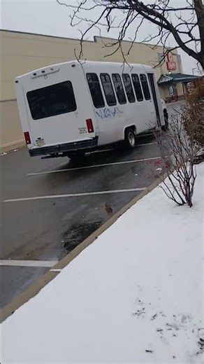 A 2010 Ford Econoline shuttle bus