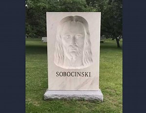 Jesus turns his head to watch you on this gravestone