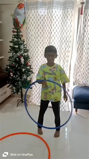 Hoop n Twirl Academy on Instagram: "Spreading Christmas joy one hoop at a time 🎄🌀 Merry Christmas to my hoop family! DM for online hula hooping classes #ChristmasJoy #HoopFamily #HulaHoopFun #FestiveVibes #HoopLove OnlineHulaHoop"