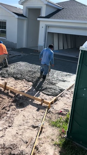 Pouring Concrete for Driveway Installation
