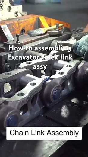 How to assembling excavator track link assy❓ #heavyequipmentparts #machinerychannel #factorylife