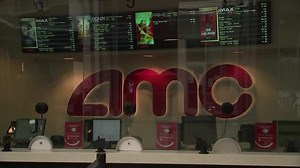 AMC shares volatile after earnings, movie deal
