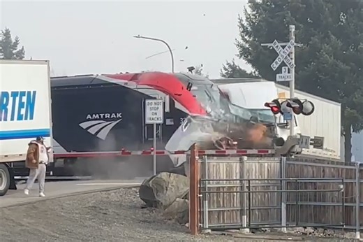 Shocking video shows Amtrak train smashing through a stalled semi-truck