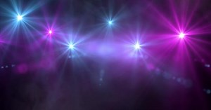 Concert lights and smoke flashing in the dark