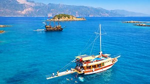 The bay where boats float on clear blue water