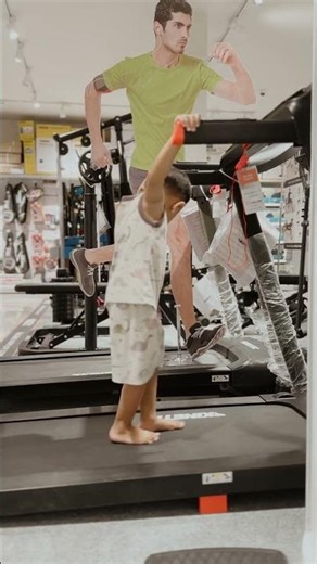 Cute Boy Learning to Walk on Treadmill