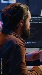 Stressed engineer feeling pressed by deadline, thinking how to finish developing code on PC. IT specialist brainstorming ways of solving database errors, working hard, drinking coffee, camera A