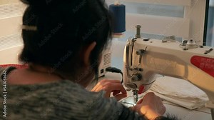 Woman Sew Working on Electric Sewing Machine. Female Seamstress Work at Home. Sunny Day. 2x Slow motion 60fps 4K