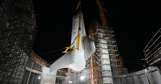 Endeavour shuttle lifted into final upright display