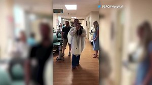 Baby in tiny cap and gown ‘graduates’ from NICU at hospital