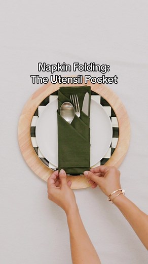 Need a clever napkin folding idea for this Thanksgiving’s dinner table? Try this utensil pocket napkin fold! Your spoon, fork, and knife with their own cute little pockets. See more easy napkins folding ideas on CharmedByCamille.com #napkinfolding #tabletop #thanksgiving #thanksgivingtablescape #thanksgivingtable #hostingtips