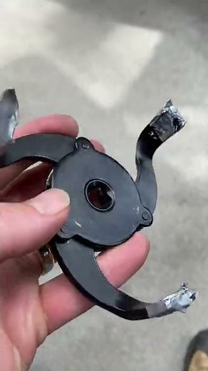 Removing a stuck oil filter using duct tape.