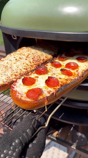 It’s almost time to go back to school and this might be my kid’s favorite after school snack. How can you go wrong with a cheesy pizza bread 😂 Made this one in the @gozney and it worked great. Some of the edges got a bit too crispy but it was still delicious 🤤 #pizzabread #recipe #snacks #grillinwithdad