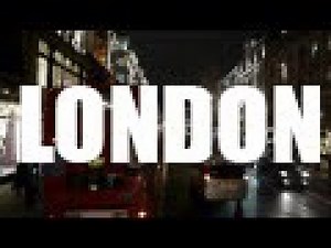 Bus driving on streets of London at night HQ
