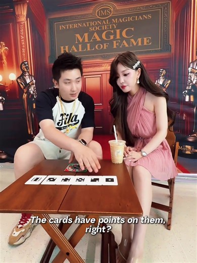 Pick up The Pointer Game by Ton Onosaka & Kaifu Wang right here: www.MJMMagic.com Want a FREE magic trick and a 10% Off COUPON code RIGHT NOW? Click this link: http://www.mjmmagic.com/freetrick The magician first took out an envelope, explained that it was a prediction and handed it to an audience member for safekeeping. Then the magician took out a board with many numbers on it and placed a rotating arrow on top of it. Next, he invited another audience to spin the arrow. After the arrow stopped