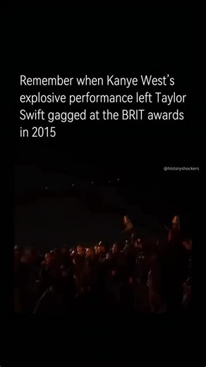 History Shockers on Instagram: "At the 2015 Brit Awards, Kanye West delivered a powerful and controversial performance of his then-unreleased track “All Day.” Introduced by Kim Kardashian, he took the stage with a large group of black-clad UK grime artists and collaborators, including Skepta, Stormzy, and Theophilus London, backed by dramatic flame-throwers and aggressive choreography. The performance was raw, intense, and visually striking, showcasing a gritty, unapologetic energy. Taylor Swift