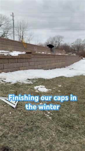 Cutting retaining wall caps with IQ saw with dustless vacuum