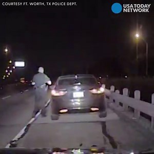 A Ft. Worth police officer pulled over a car, and when he walked up to the window, a drunk driver slammed into him. The officer is expected to be OK. | USA TODAY Video