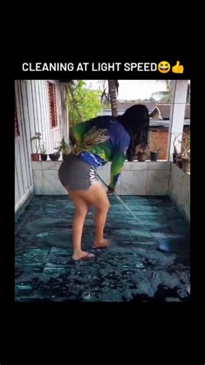 Zynox on Instagram: "The video depicts an Indonesian woman rapidly cleaning a tiled outdoor floor by pouring excessive blue liquid soap to create thick foam, spreading it with a hose, and mopping it away in about 16 seconds, resulting in a gleaming surface amid upbeat music and tropical surroundings. - Posted on December 23, 2025, by lifestyle content creator @gustiayutp, the clip has exploded to over 546,000 views, 615 likes, and 295 replies, with users in Indonesian humorously critiquing the s