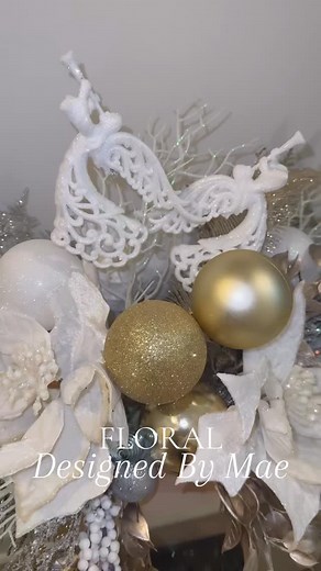 I designed these stunning Christmas white poinsettia centerpieces to bring my winter wonderland theme decor to life. To elevate my slim pencil Christmas tree, I added fairy twinkle LED lights, infusing it with an extra touch of magic and capturing the essence of a viral-inspired Christmas tree. #christmashomedecor #christmas #christmasentryway #christmastree #holidaydecor #homedecor #floraldesignedbymae | Designed By Mae | Facebook