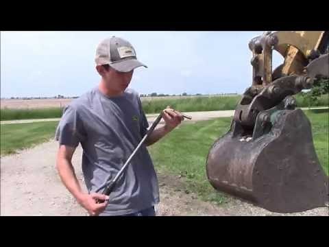 How To: Change Buckets with a Caterpillar Mini Excavator Manual Quick Coupler