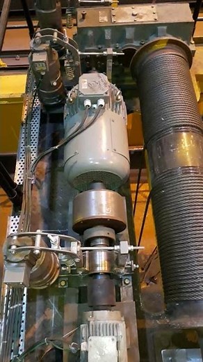 Main hoist and auxiliary hoist motor coupling and brake arrangement.