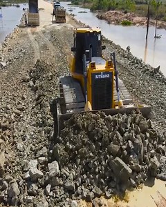 2K views · 58 reactions | Masterful Bulldozer Operation: Paving the Way – Transporting Stones to Forge a New Road Across Running Waters . . . . #bulldozer #excavator #heavyequipment #caterpillar #komatsu #dozer #heavymachinery #construction #earthmoving #hitachi #kobelco #earthmover #wheelloader #dumptruck #excavators #cat #excavation #hydraulics #dozers #volvo | Bulldozer City | Facebook