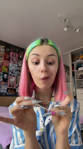 Vibrant Hair and Colorful Nails in a Fun Bedroom Setting