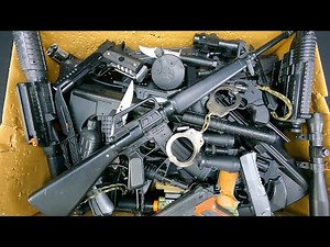 Box of Toy Realistic Black Color Guns, Bead Shooter And Capsule Explosion Guns