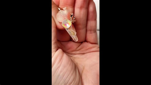 Creating nail art with 3D floral motifs in peach and crystal clear colors