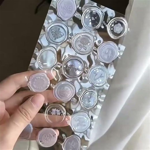 A charming set of vintage-style wax seal stickers that add instant elegance to envelopes, gifts,