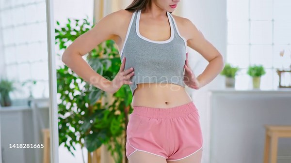 close up asian girl showing her body iat home