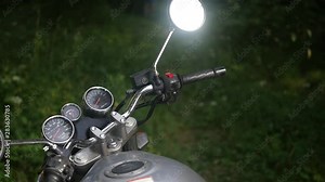 Speedometer, odometer and ignition key on motorcycle dashboard. Close up control panel motorcycle