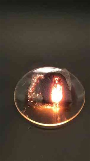 Pouring liquid oxygen onto steel wool