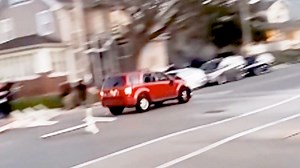 Video shows SUV crashing through parade barriers