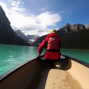 We're here with your daily escape travel video - today we're canoeing across Canada's Lake Louise 😍 | Lonely Planet