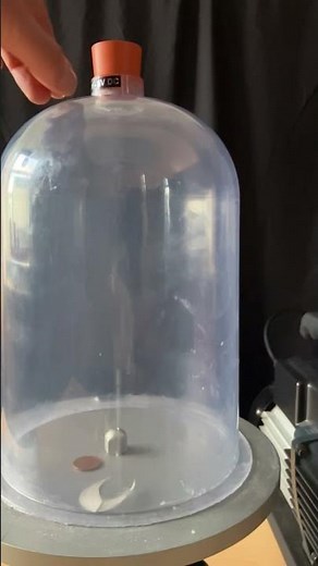 Demonstrating the effect of removing air resistance with a bell jar and vacuum pump #physics